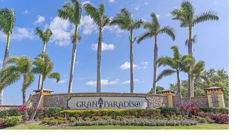 Gran Paradiso community entrance sign framed by palm trees in Venice, Florida (Wellen Park)